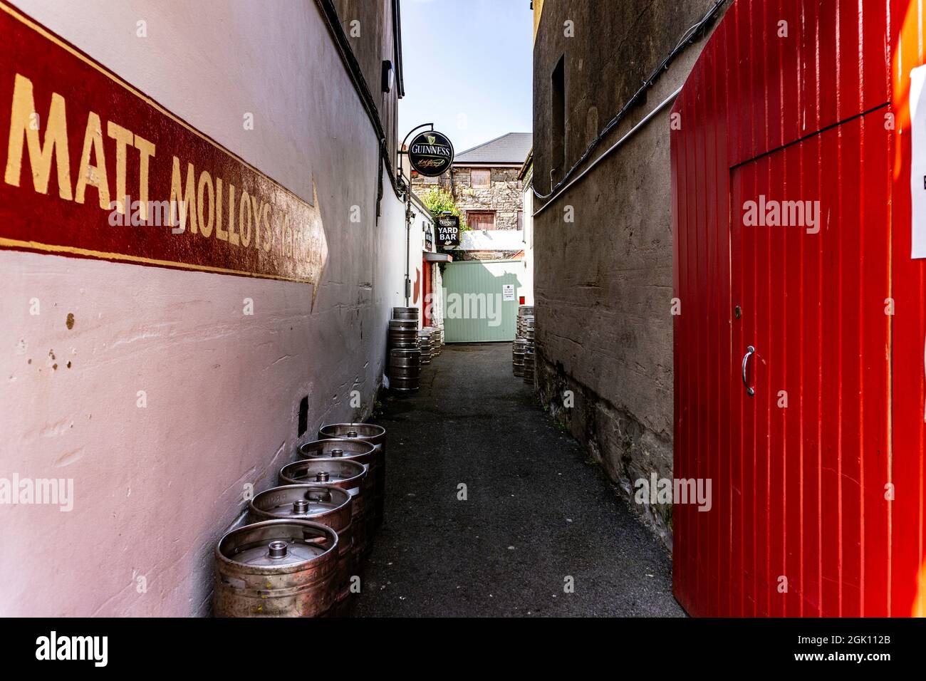 Beer kegs stacked in the laneway beside Matt Molloy's pub in Westport, County Mayo, Ireland. Stock Photo
