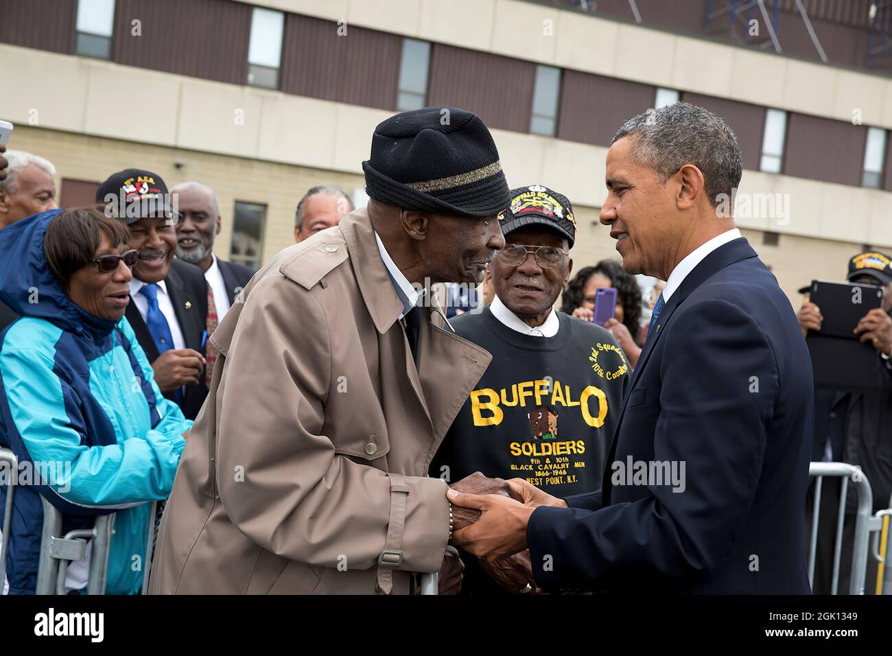 President Barack Obama greets 93-year-old Sanders H. Matthews, Sr., a retired U.S. Army Staff Sergeant and 'buffalo soldier,' at Stewart Air National Guard Base prior to departure from Newburgh, New York, May 28, 2014. (Official White House Photo by Pete Souza) This official White House photograph is being made available only for publication by news organizations and/or for personal use printing by the subject(s) of the photograph. The photograph may not be manipulated in any way and may not be used in commercial or political materials, advertisements, emails, products, promotions that in any Stock Photo