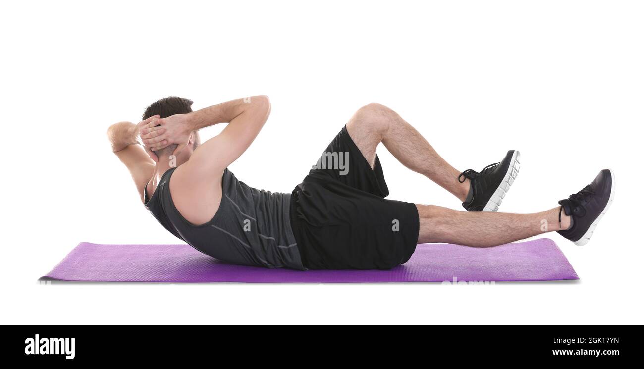 Young man doing bicycle crunch exercise on white background Stock Photo Alamy