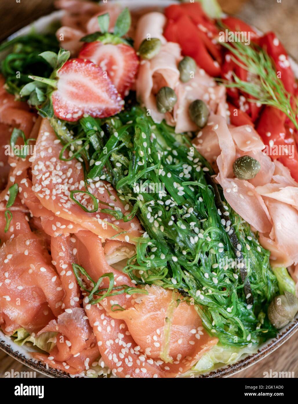 Healthy light smoked salmon, wakame and ginger bowl, close-up Stock Photo