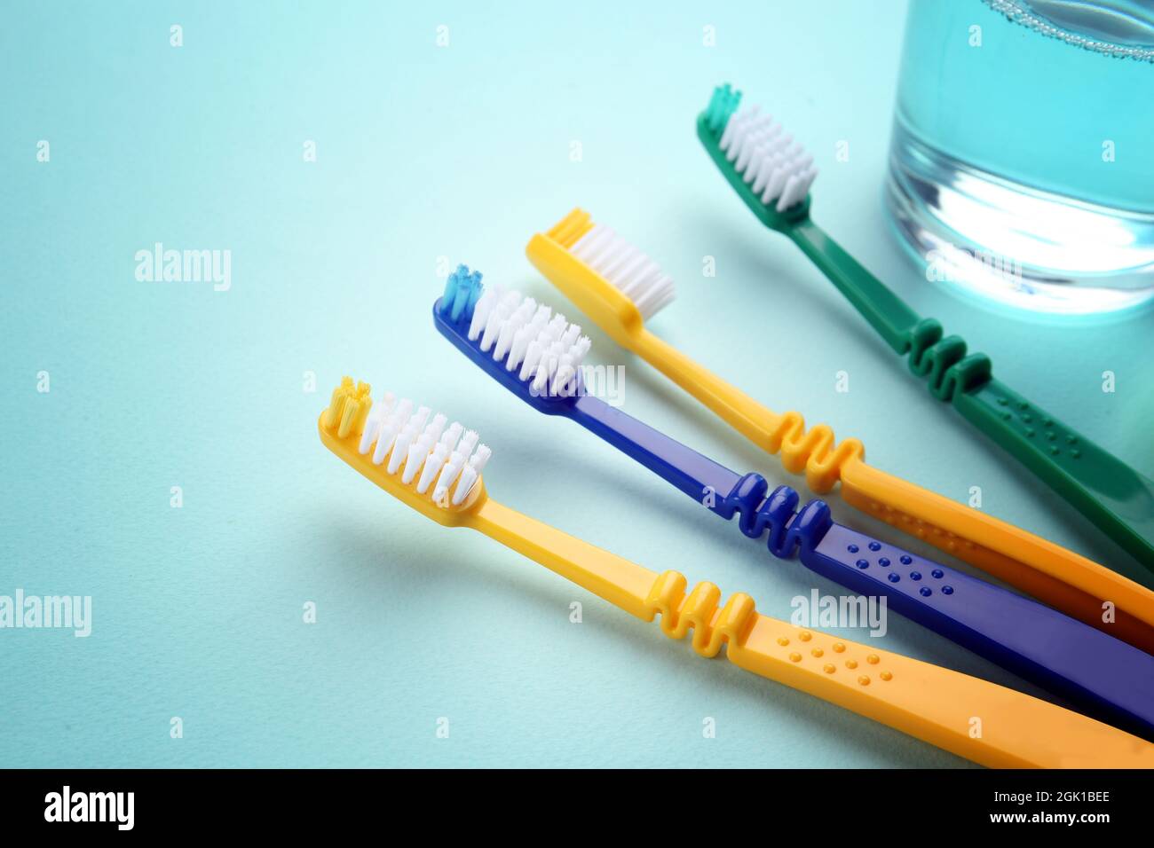 Set of toothbrushes on color background Stock Photo - Alamy
