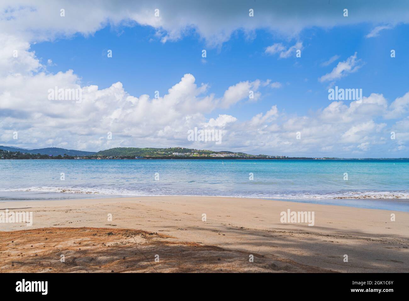 Luquillo beach in tropical Puerto Rico and white puffy clouds Stock Photo