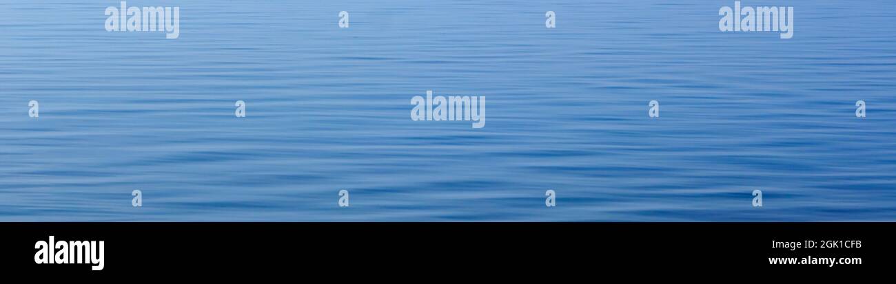 Blue ripples on the water surface, natural blue background for banner Stock Photo