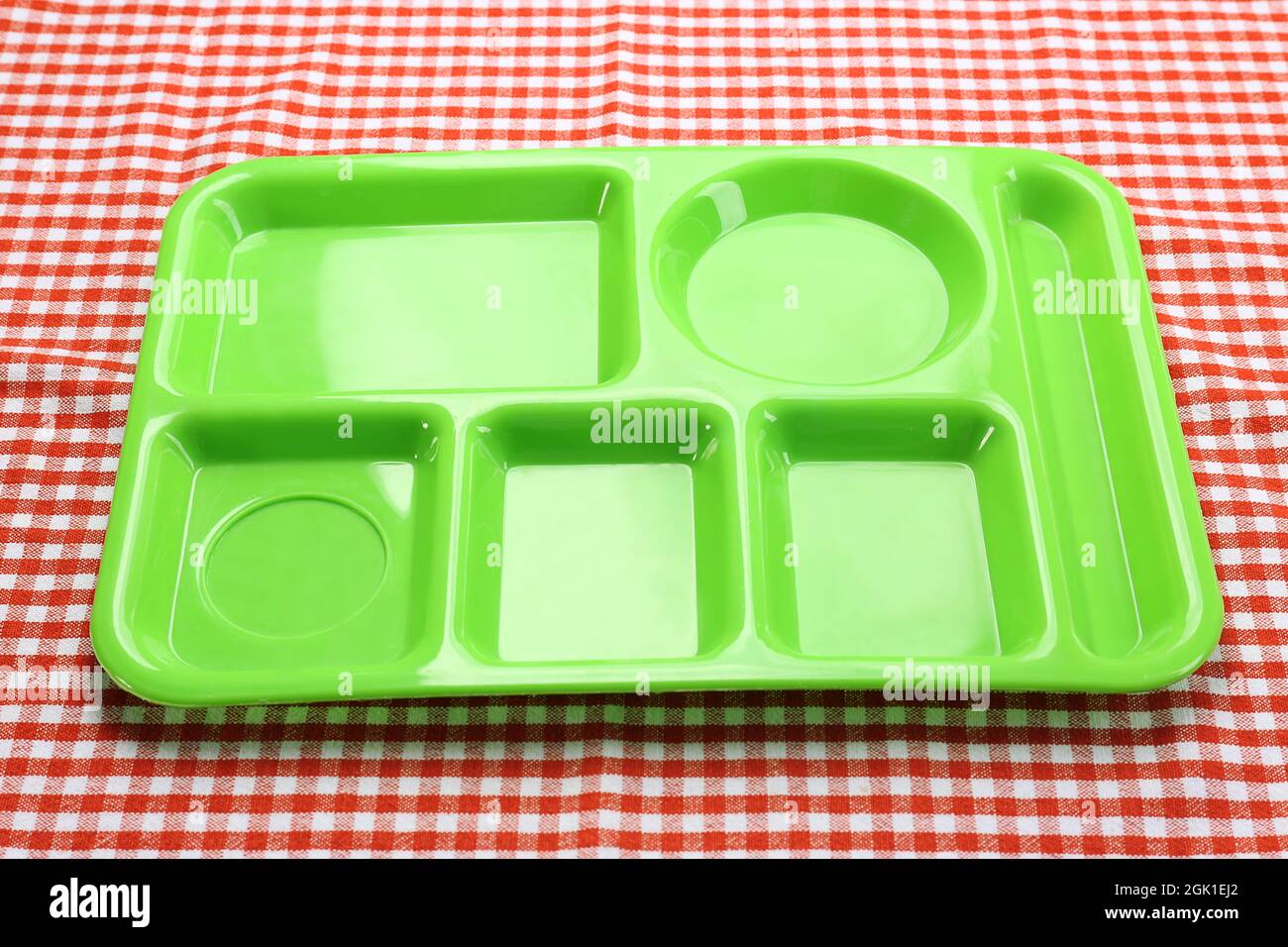 Empty serving tray for food on tablecloth. Concept of school lunch