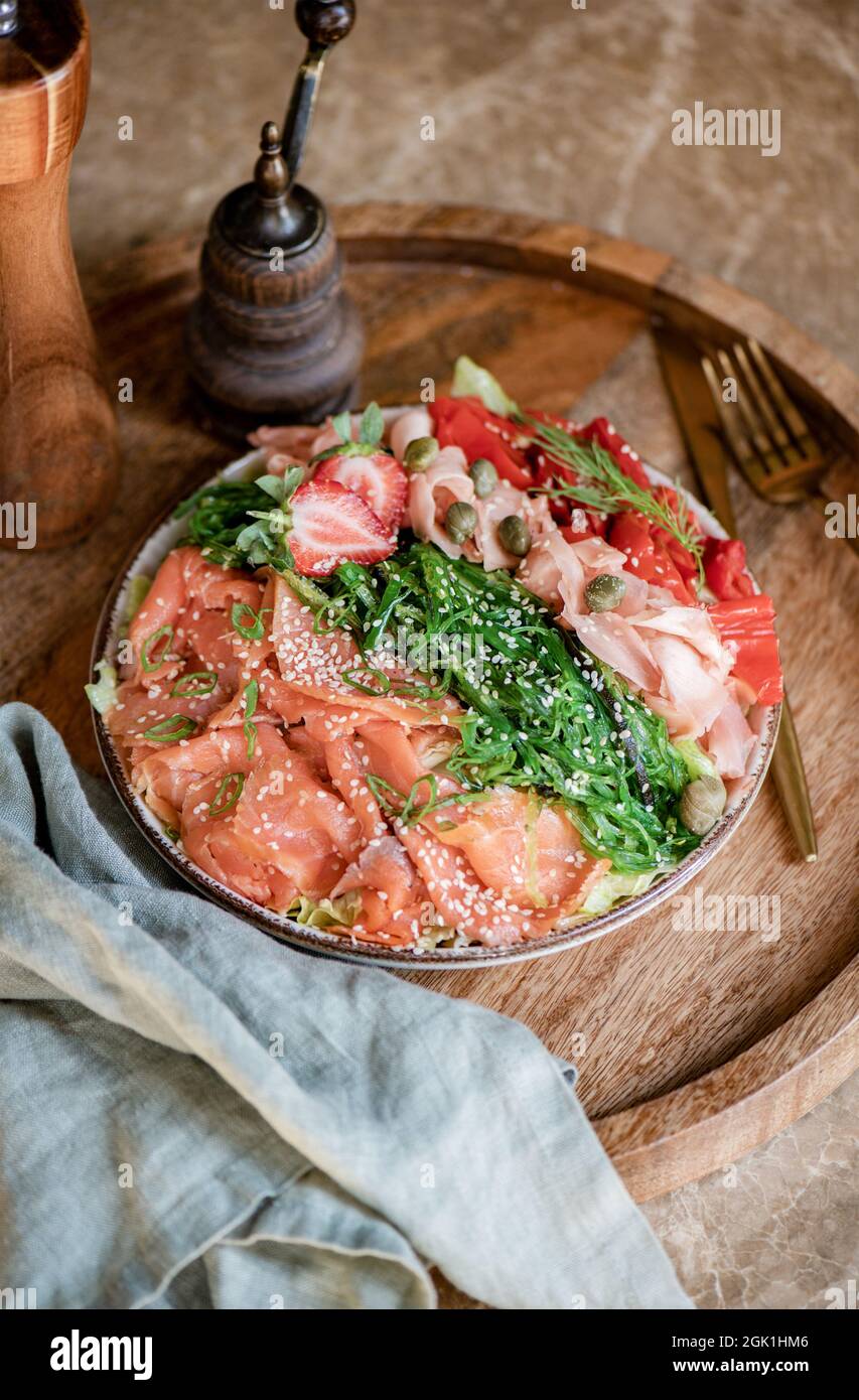 Healthy light smoked salmon, wakame and ginger bowl Stock Photo