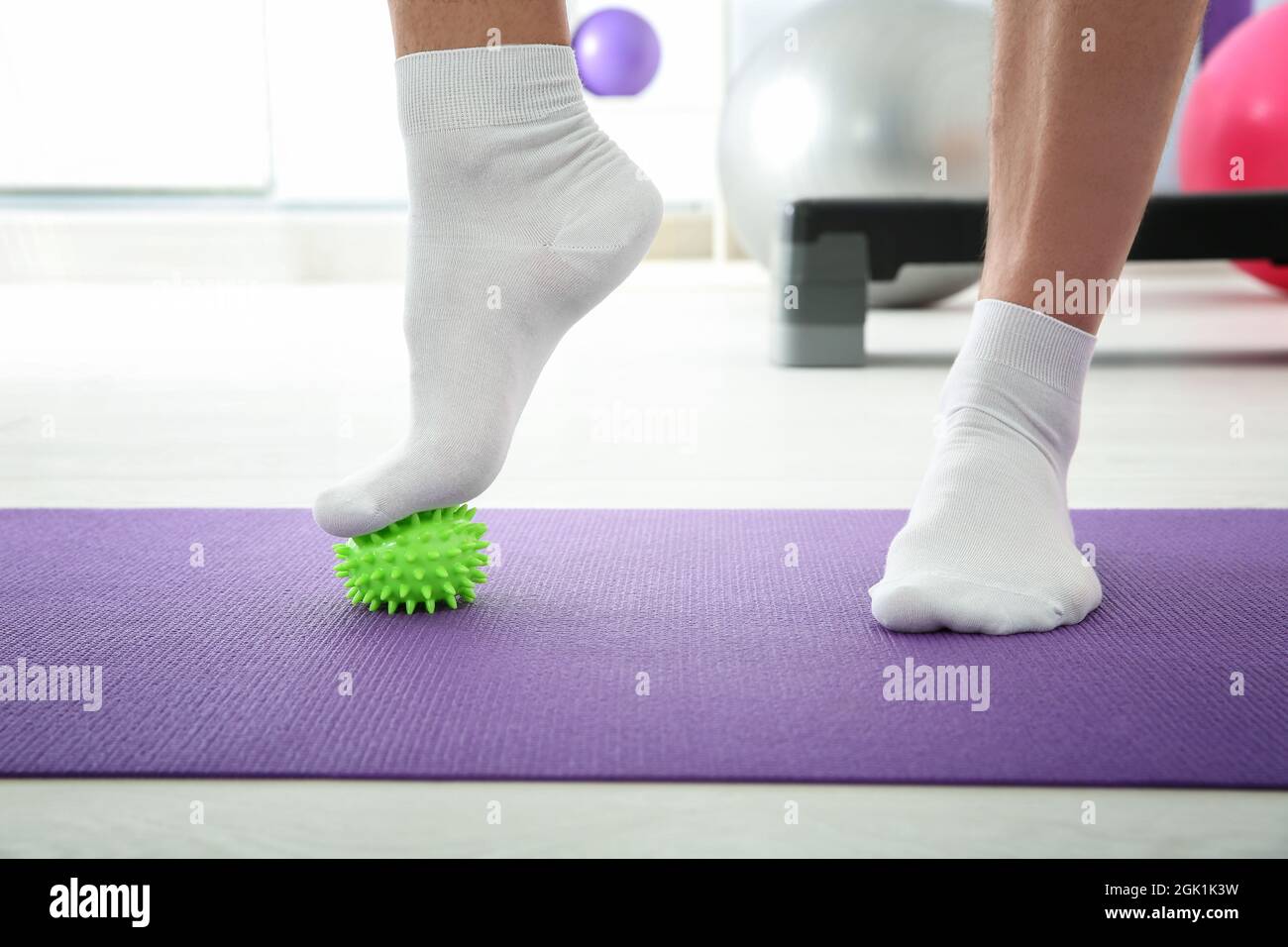 Feet of man doing exercises with stress ball in clinic Stock Photo Alamy