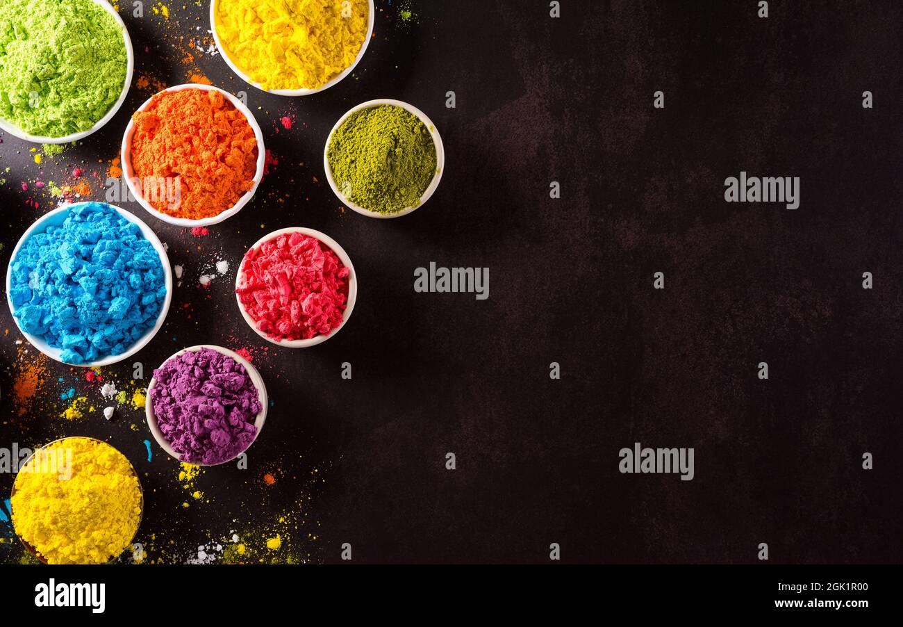 Photo & Art Print Indian Holi festival colours in four bowls on dark  background