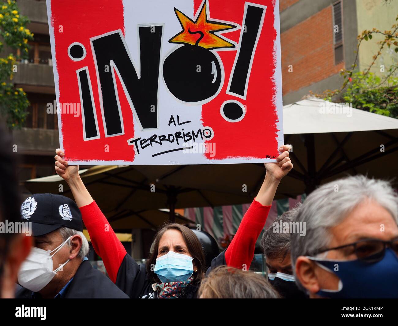 A Woman Holding A No To Terrorism Sign When Hundreds Of People Gather 