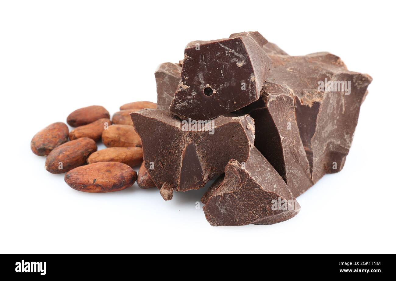 Pile of dark chocolate chunks and cocoa beans on white background Stock ...