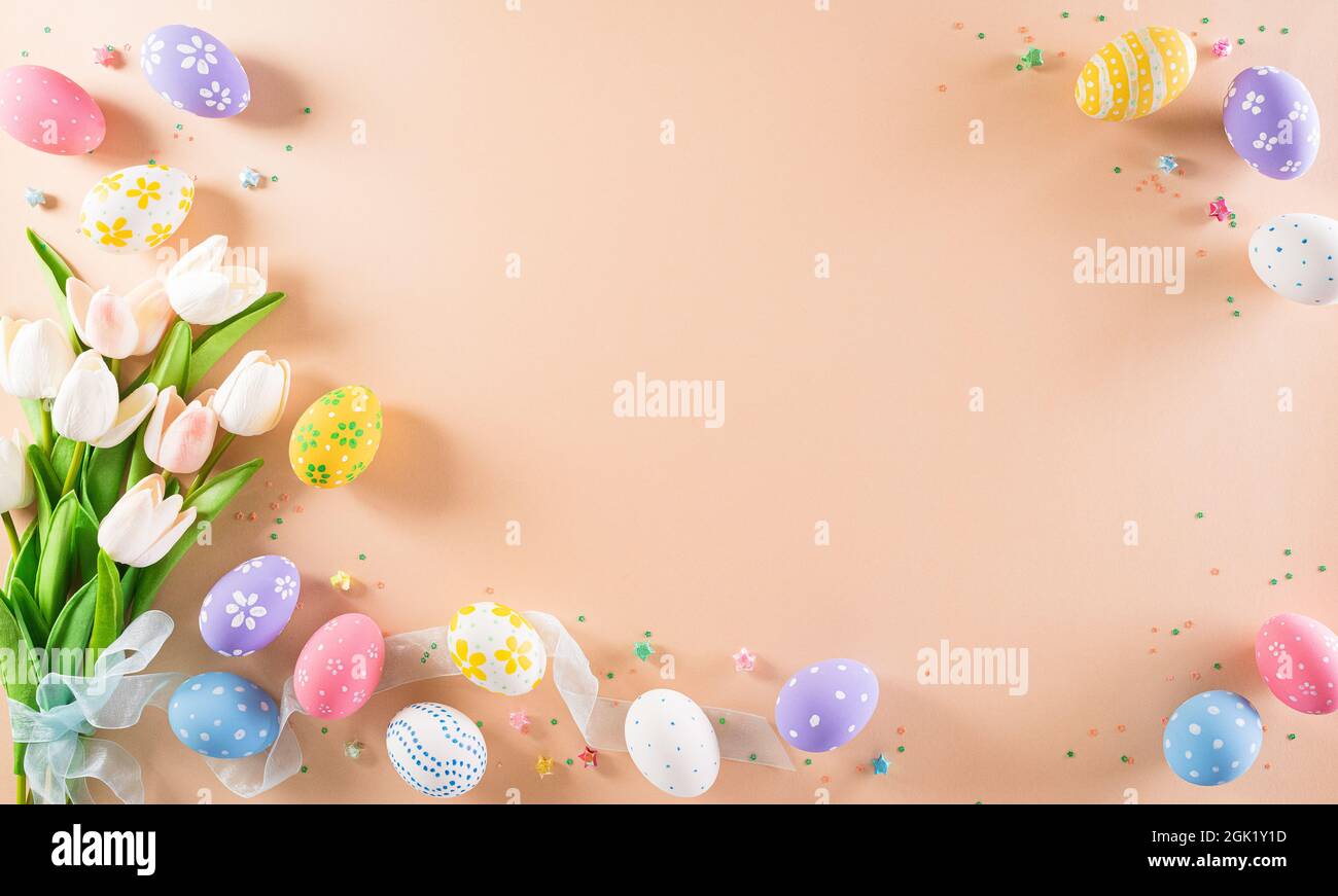Happy easter! Colourful of Easter eggs in with flower on pastel ...