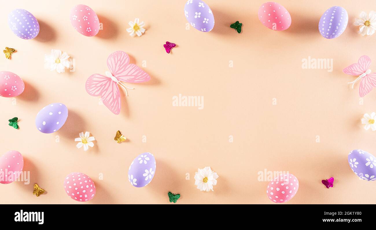 Happy easter! Colourful of Easter eggs in with flower on pastel ...