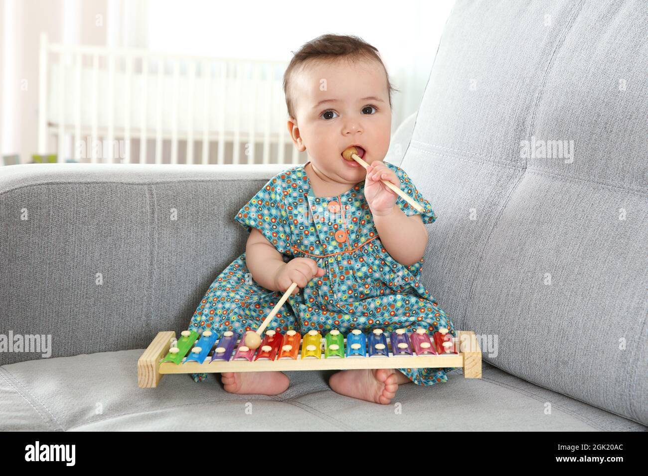 Cute little baby with xylophone at home Stock Photo Alamy