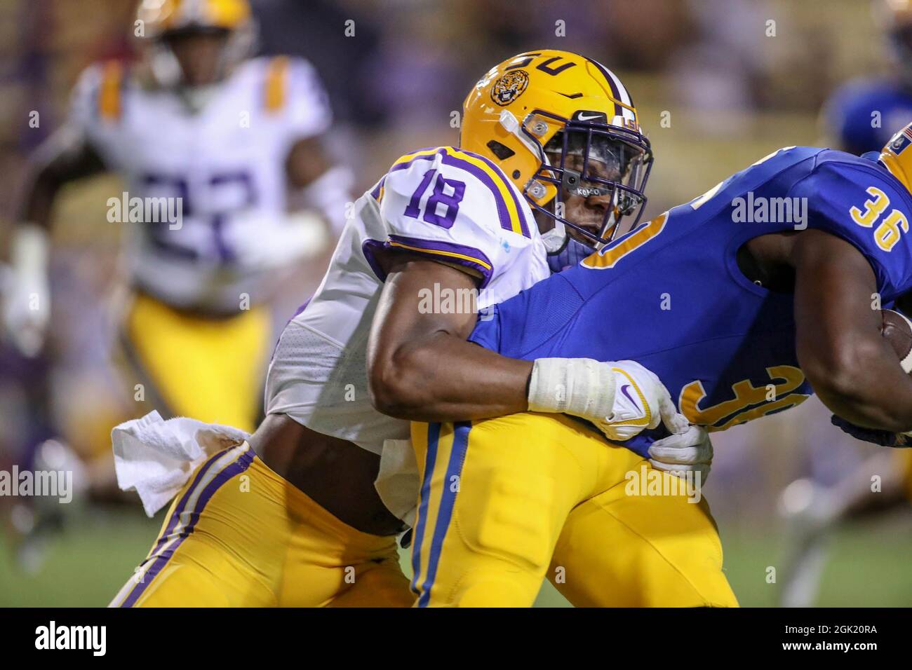 Baton Rouge, LA, USA. 11th Sep, 2021. LSU linebacker Damone Clark (18) brings down a McNeese runner during NCAA football game action between the McNeese State University Cowboys and the LSU Tigers at Tiger Stadium in Baton Rouge, LA. Jonathan Mailhes/CSM/Alamy Live News Stock Photo