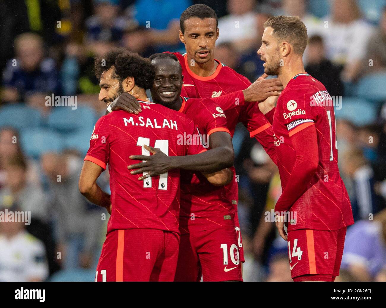 Leeds. 13th Sep, 2021. Liverpool's Sadio Mane (2nd L) celebrates with teammates Mohamed Salah (1st L), Joel Matip (2nd R) and Jordan Henderson after scoring during the Premier League football match between Leeds United and Liverpool in Leeds, Britain, on Sept. 12, 2021. Credit: Xinhua/Alamy Live News Stock Photo