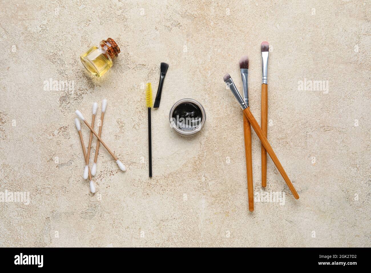 Henna and tools for eyebrows correction on color background Stock Photo