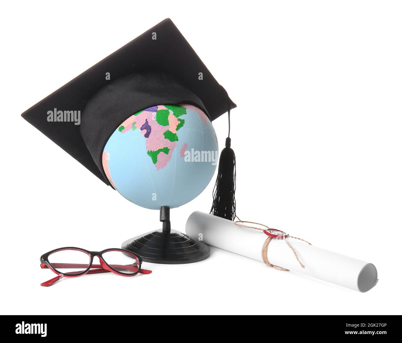 Globe with mortar board, diploma and eyeglasses on white background ...