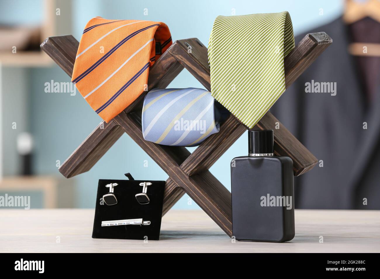 Stand with different stylish male accessories on table Stock Photo - Alamy