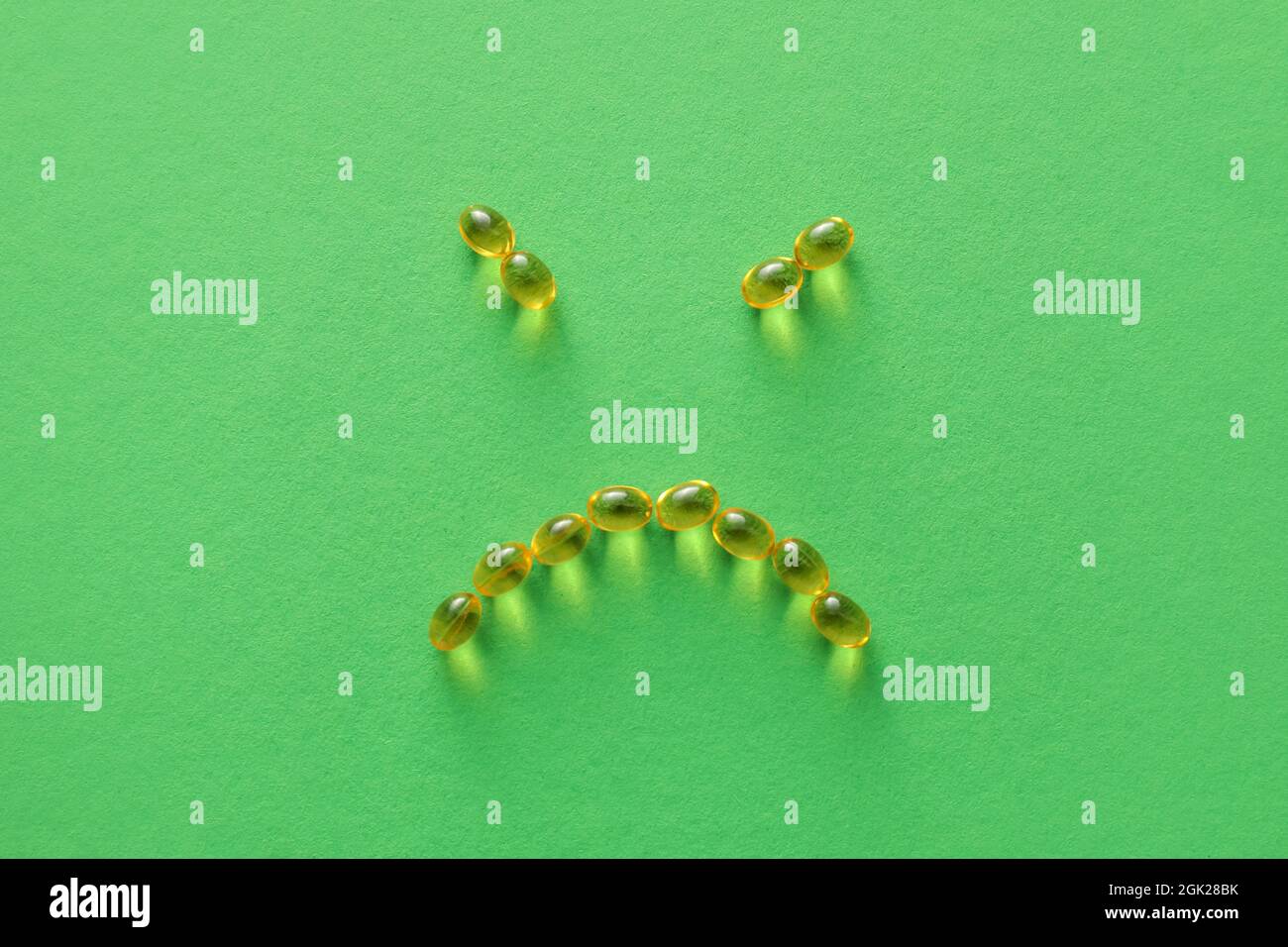 Face made of pills on color background Stock Photo - Alamy