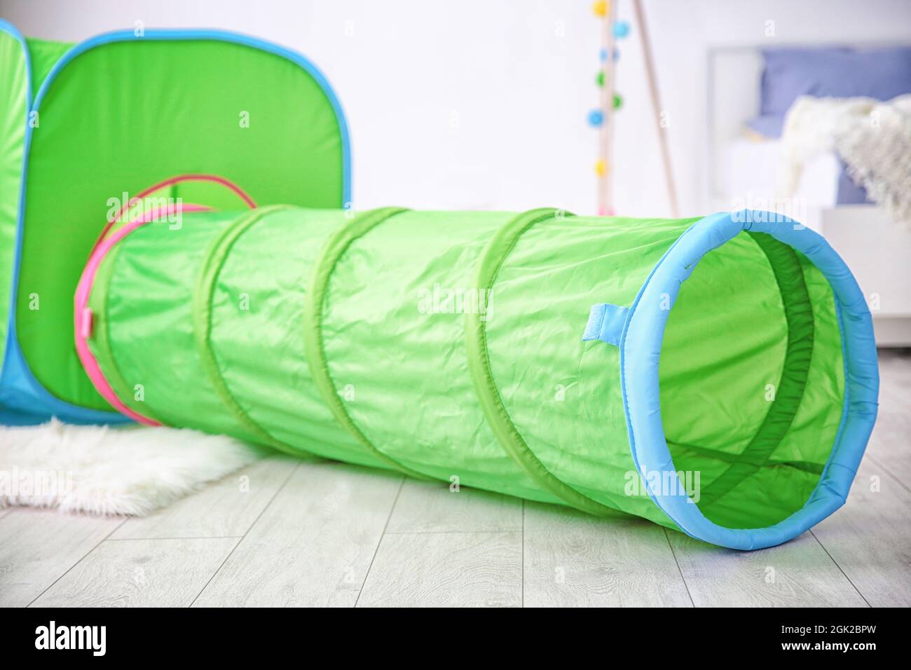 Toy tunnel and tent in baby room Stock Photo Alamy