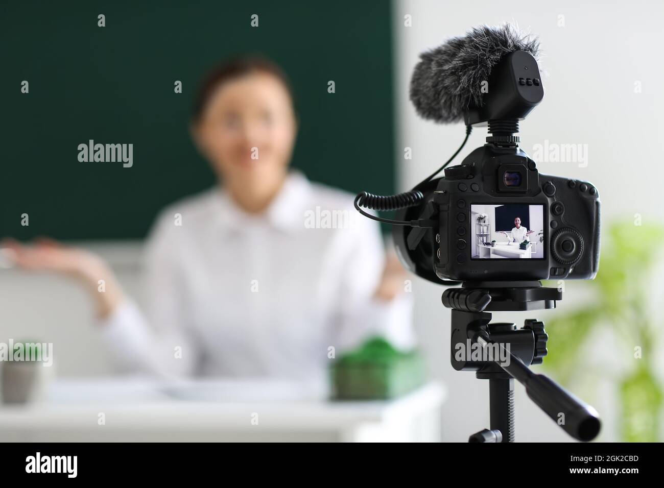 Teacher recording video for his students in classroom Stock Photo Alamy