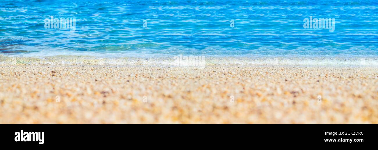summer beach low angle view background.Close up wave of blue sea on sand beach seashore Stock Photo