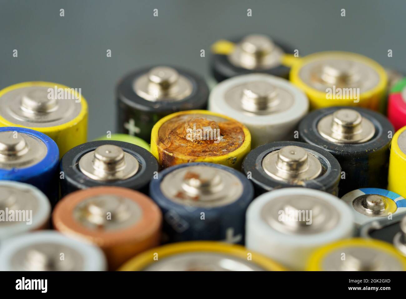 Close up of used battery with traces of rust and corrosion. Electronic