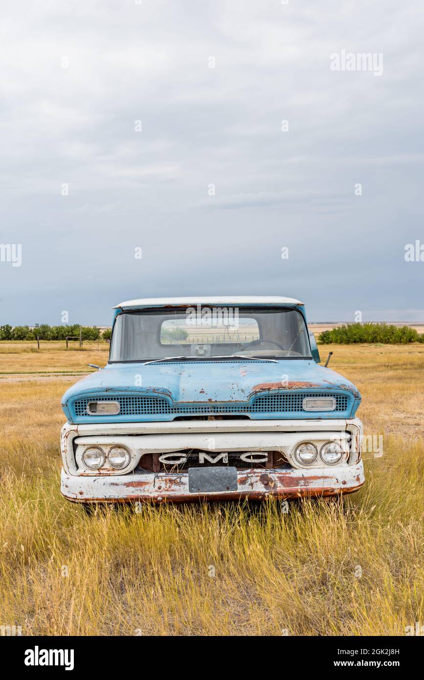 Robsart, SK- August 21, 2021:  Abandoned vintage blue and white GMC pick up truck on the Saskatchewan prairies Stock Photo