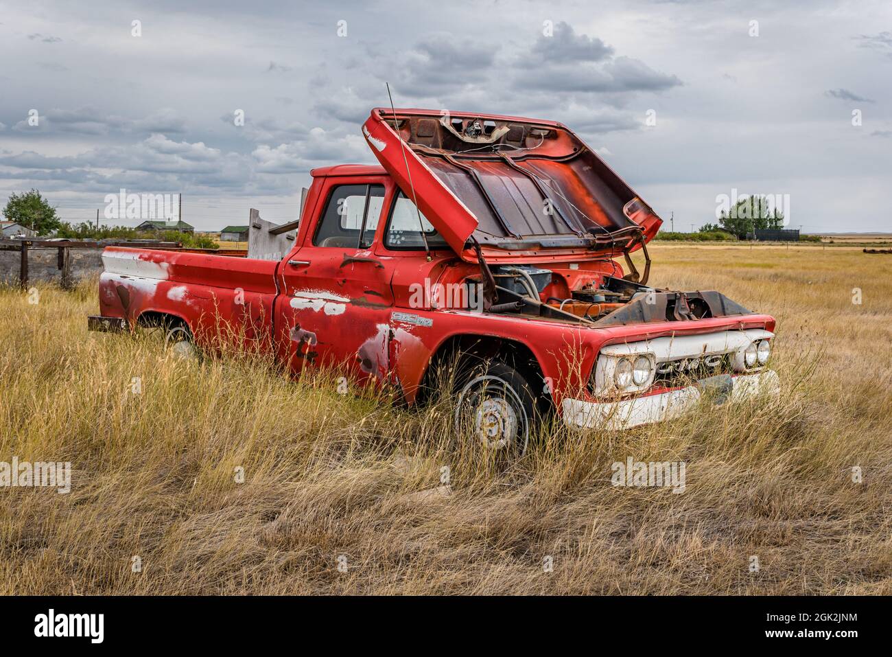 Robsart, SK- August 21, 2021:  Abandoned vintage red GMC 910 pick up truck on the Saskatchewan prairies Stock Photo
