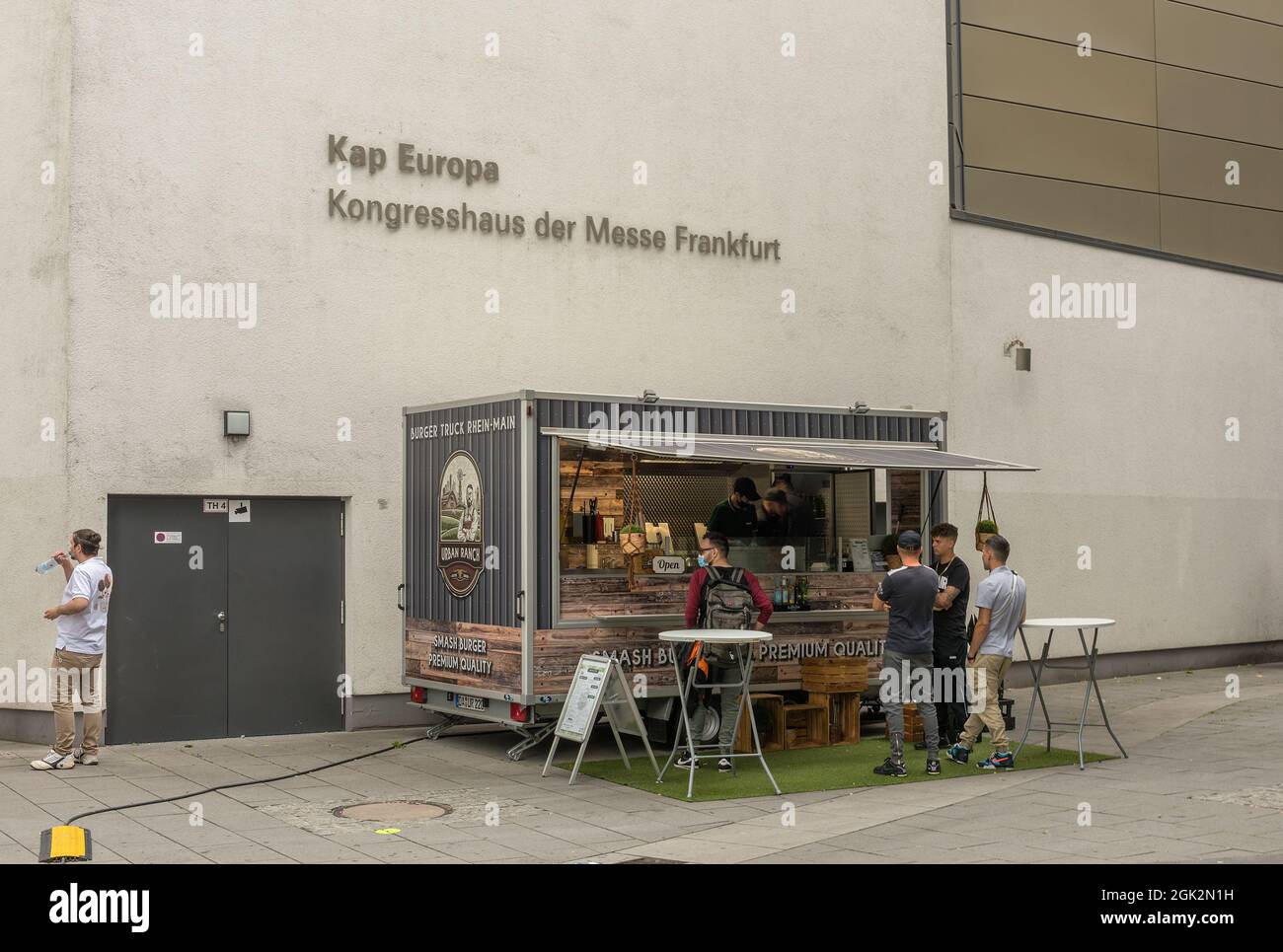Food truck with customers in front of the exhibition center, Frankfurt, Germany Stock Photo