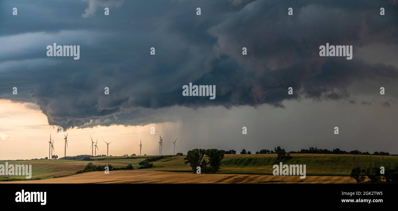 ThunderStorm over fields, a huge storm cloud that causes heavy rainfall Stock Photo