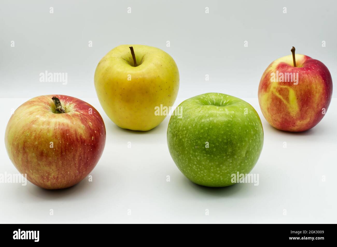 Apple Variants Ripe Four different varieties of ripe apples isolated on white background ...