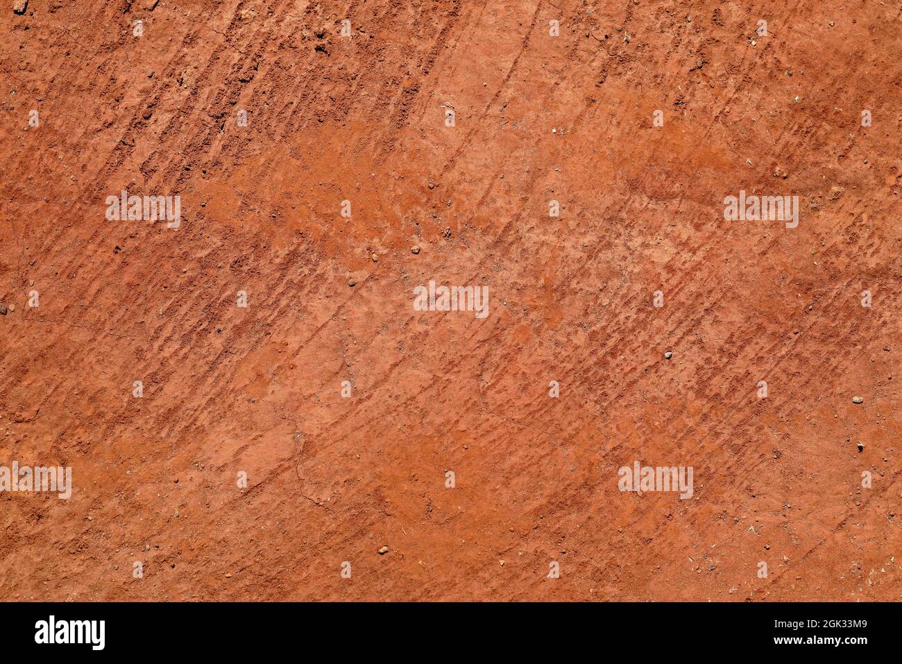 Abstract natural background from texture of orange red terracota clay soil Stock Photo