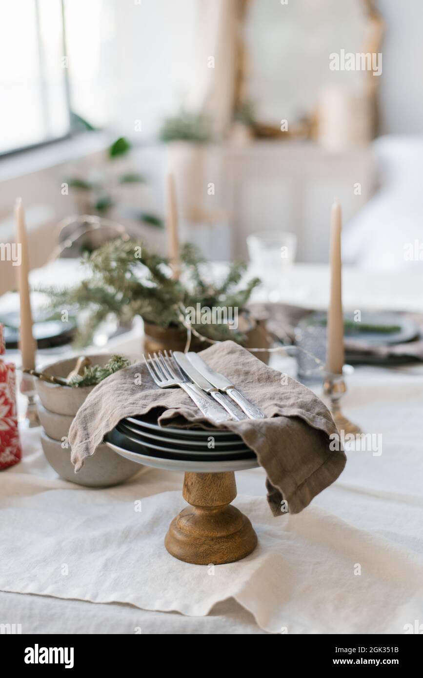 Beautiful table setting for Christmas dinner in Scandinavian style