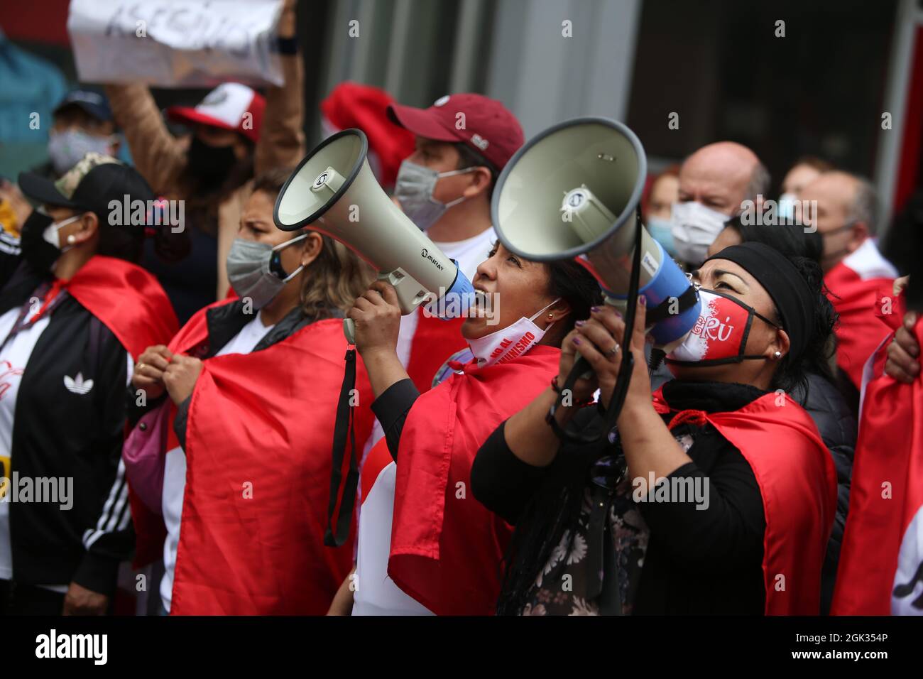 Lima, Peru. 12th Sep, 2021. Women cheer the death of Peruvian guerrilla leader Guzman with their megaphones. The former leader of the Peruvian guerrilla organization Shining Path (Sendero Luminoso) is dead. Abimael Guzmán died at the age of 86 in a maximum security prison, the prison administration announced on Saturday (11/09/2021). Almost 70,000 people were killed in clashes between the Sendero Luminoso and state security forces between 1980 and 2000. Credit: Cesar Lanfranco/dpa/Alamy Live News Stock Photo