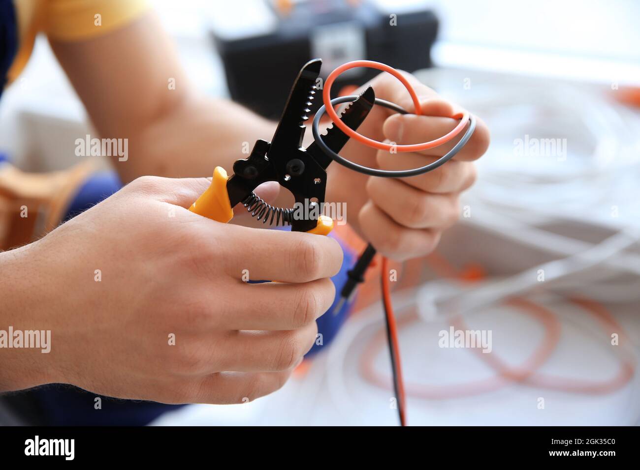 Electrician cutting wires indoors, closeup Stock Photo Alamy