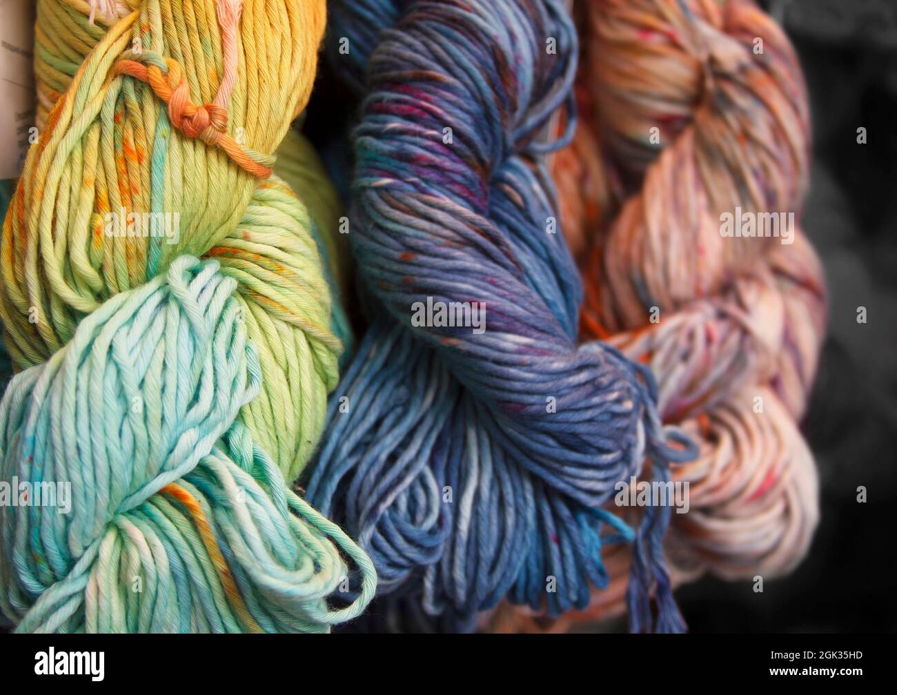 Diversified cotton yarn for knitting. Hand-dyed threads. Modern tie dye. Craft and hobby. Multicolored background Stock Photo