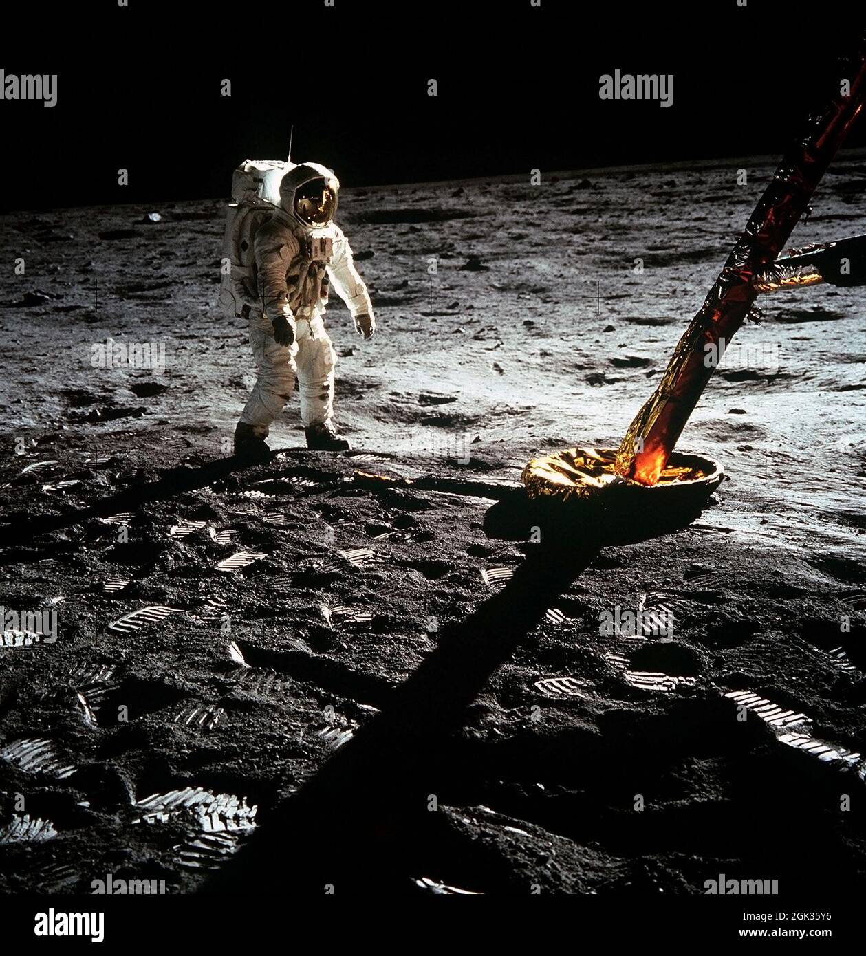 (20 July 1969) --- Astronaut Edwin E. Aldrin Jr., lunar module pilot, walks on the surface of the moon near a leg of the Lunar Module during the Apollo 11 extravehicular activity (EVA). Astronaut Neil A. Armstrong, Apollo 11 commander, took this photograph with a 70mm lunar surface camera. The astronauts' bootprints are clearly visible in the foreground. Stock Photo