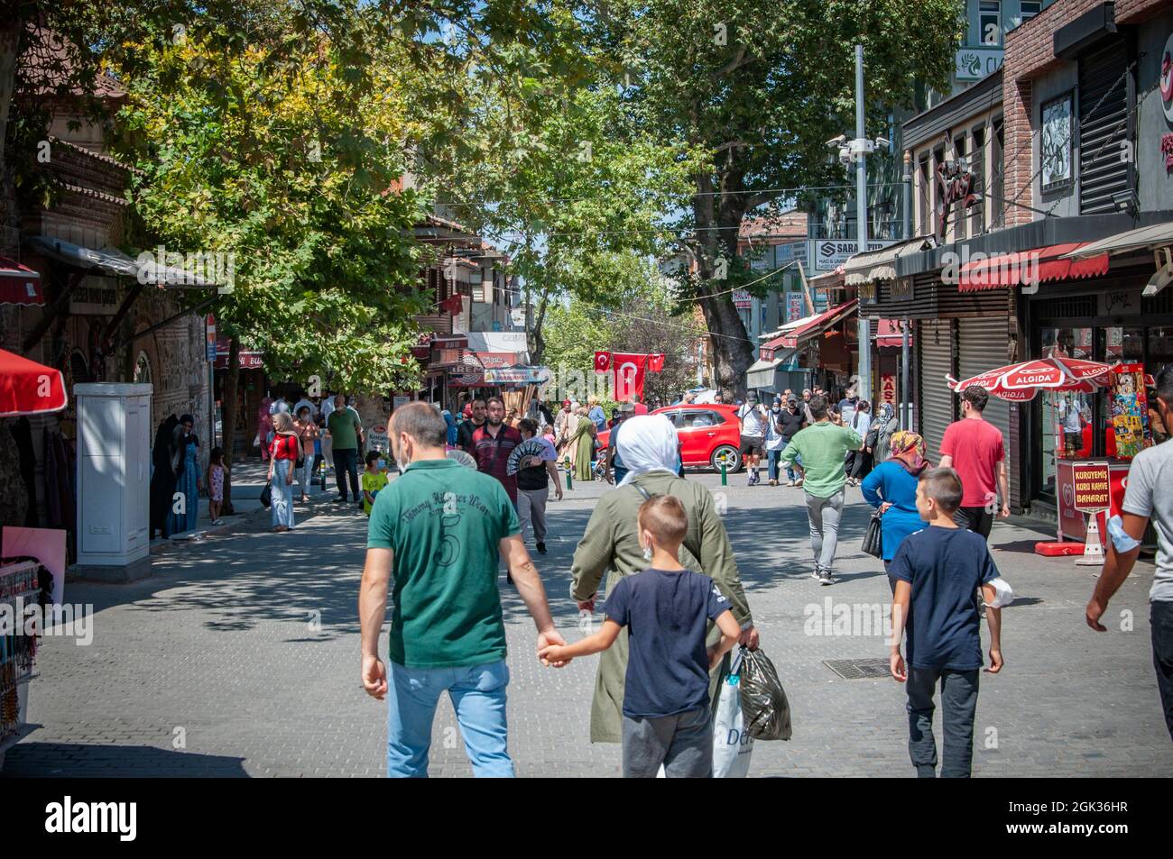 BURSA, TURKEY. AUGUST 15, 2021. Street view, A lot of people on the square. Small shops and cafe. Stock Photo