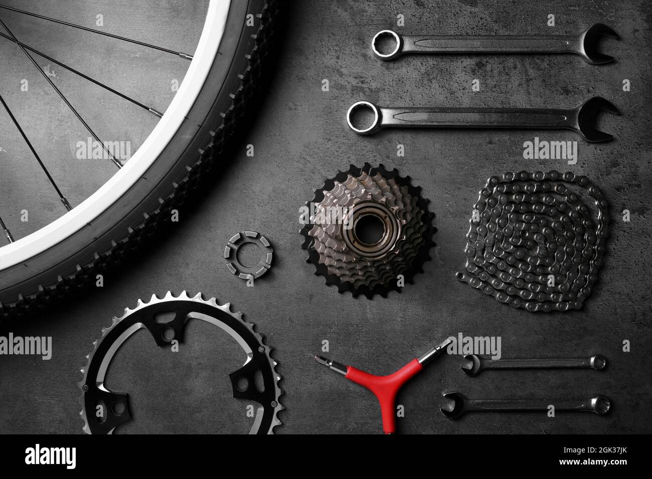 Bicycle parts and repair tools on gray background Stock Photo Alamy