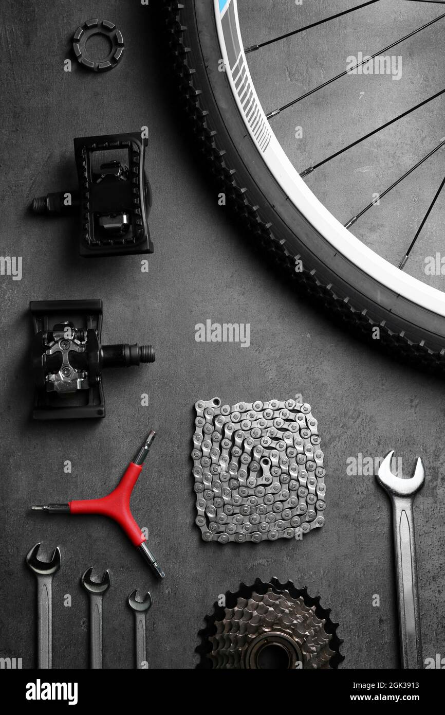 Bicycle parts and repair tools on gray background Stock Photo Alamy