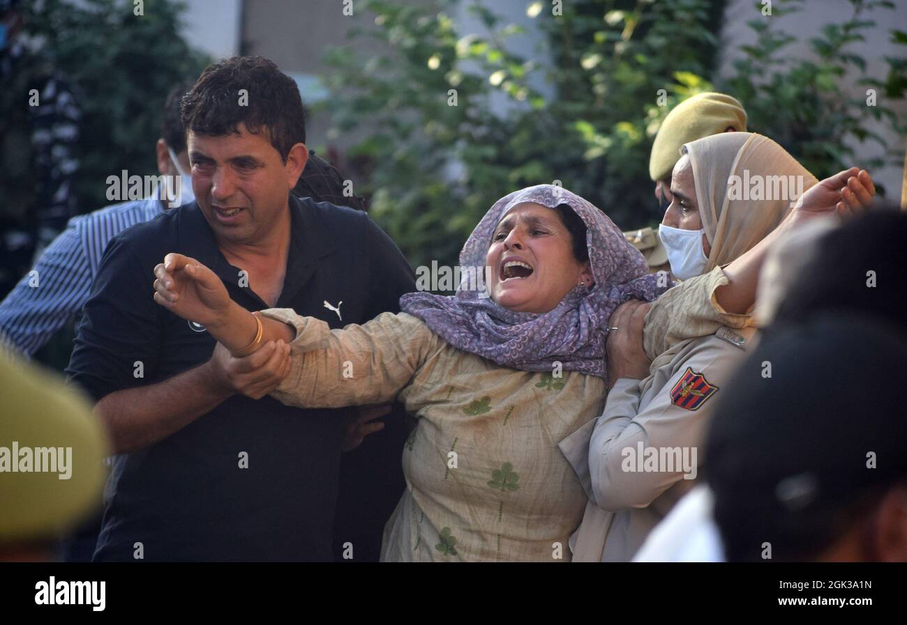 Srinagar. 12th September 2021. Emotional scenes during the wreath laying ceremony of the police officer who was shot dead by militants. A police officer was killed in a militant attack at Khanyar. The SI identified as Arshid Ahmad was a resident of Kulmuna Kupwara. The area was cordoned off and a hunt launched to arrest the attackers. Credit: Majority World CIC/Alamy Live News Stock Photo
