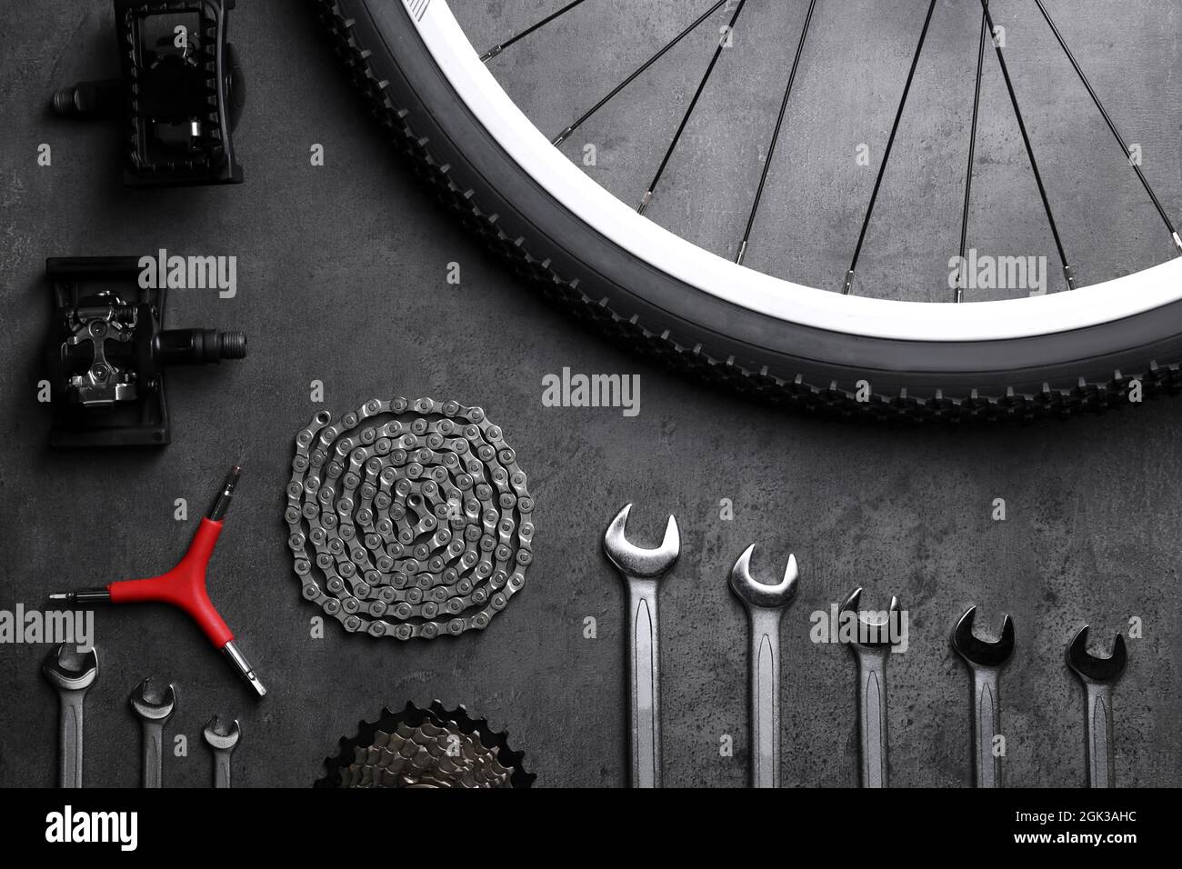 Bicycle parts and repair tools on gray background Stock Photo Alamy