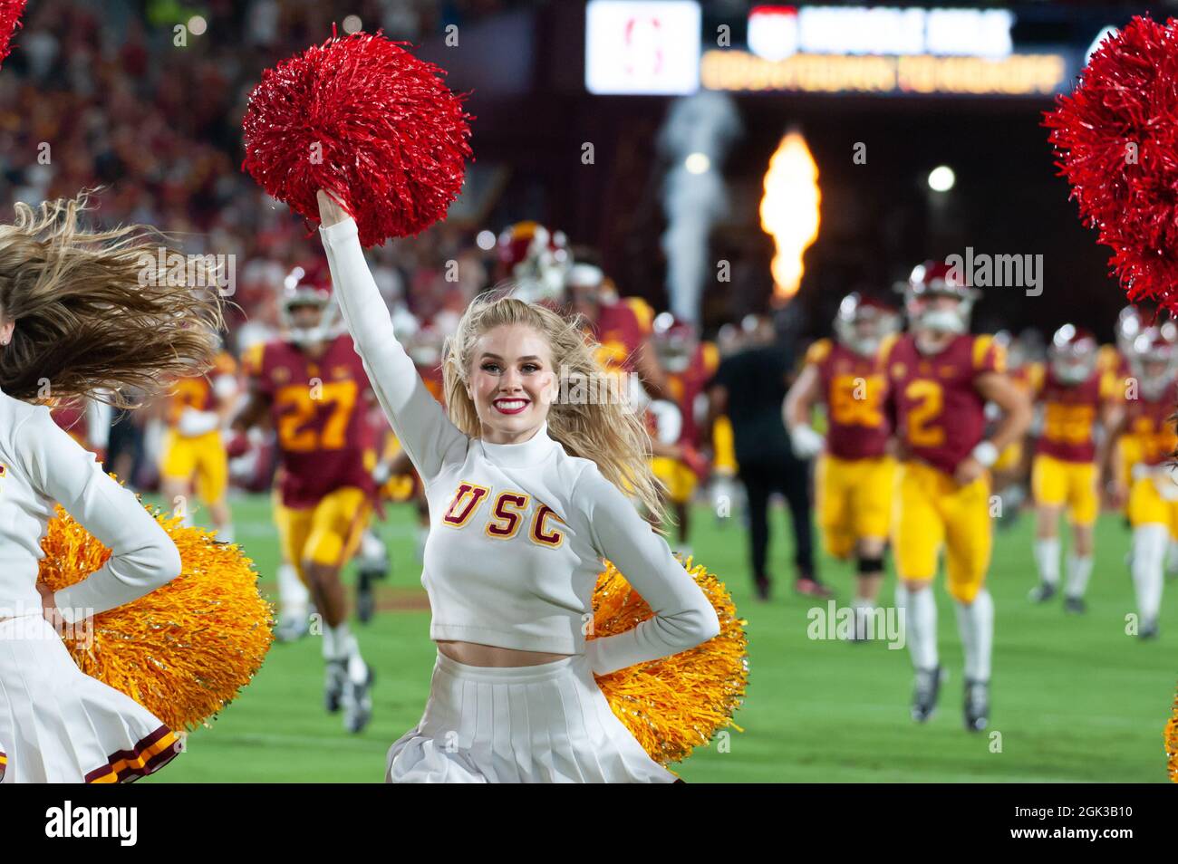 Southern California Trojans cheer leaders run onto the field before a NCAA football game between the Southern California Trojans and the Stanford Card Stock Photo