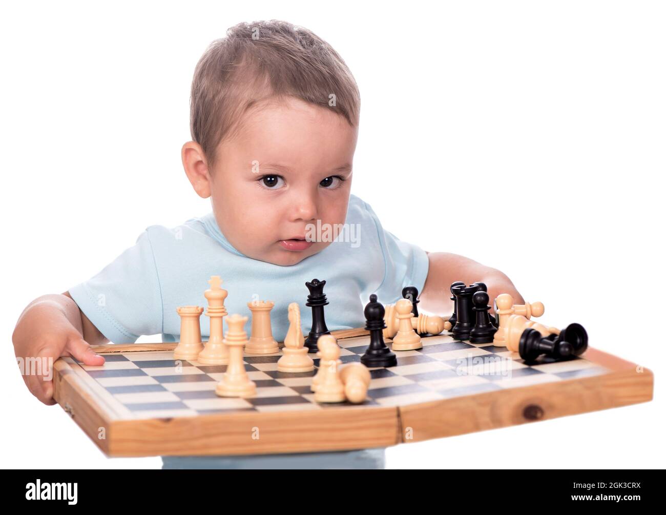 Premium Photo  Portrait of child during chess game boy plays chess and  thinks intently about the next move isolation on white background