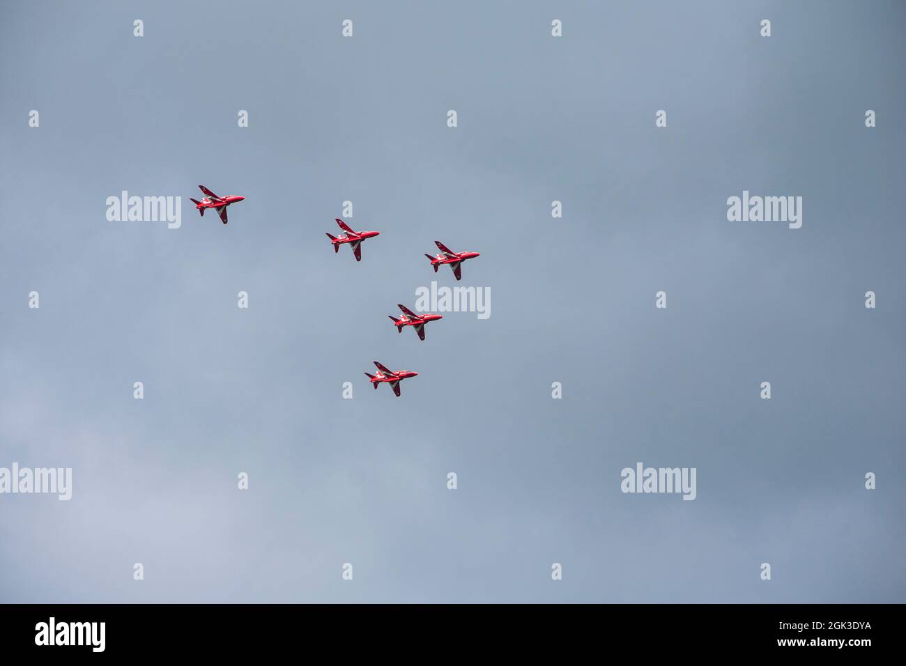 Red Arrows flying in formation over Ullswater on the way to the Great North Run, Lake District, Cumbria Stock Photo