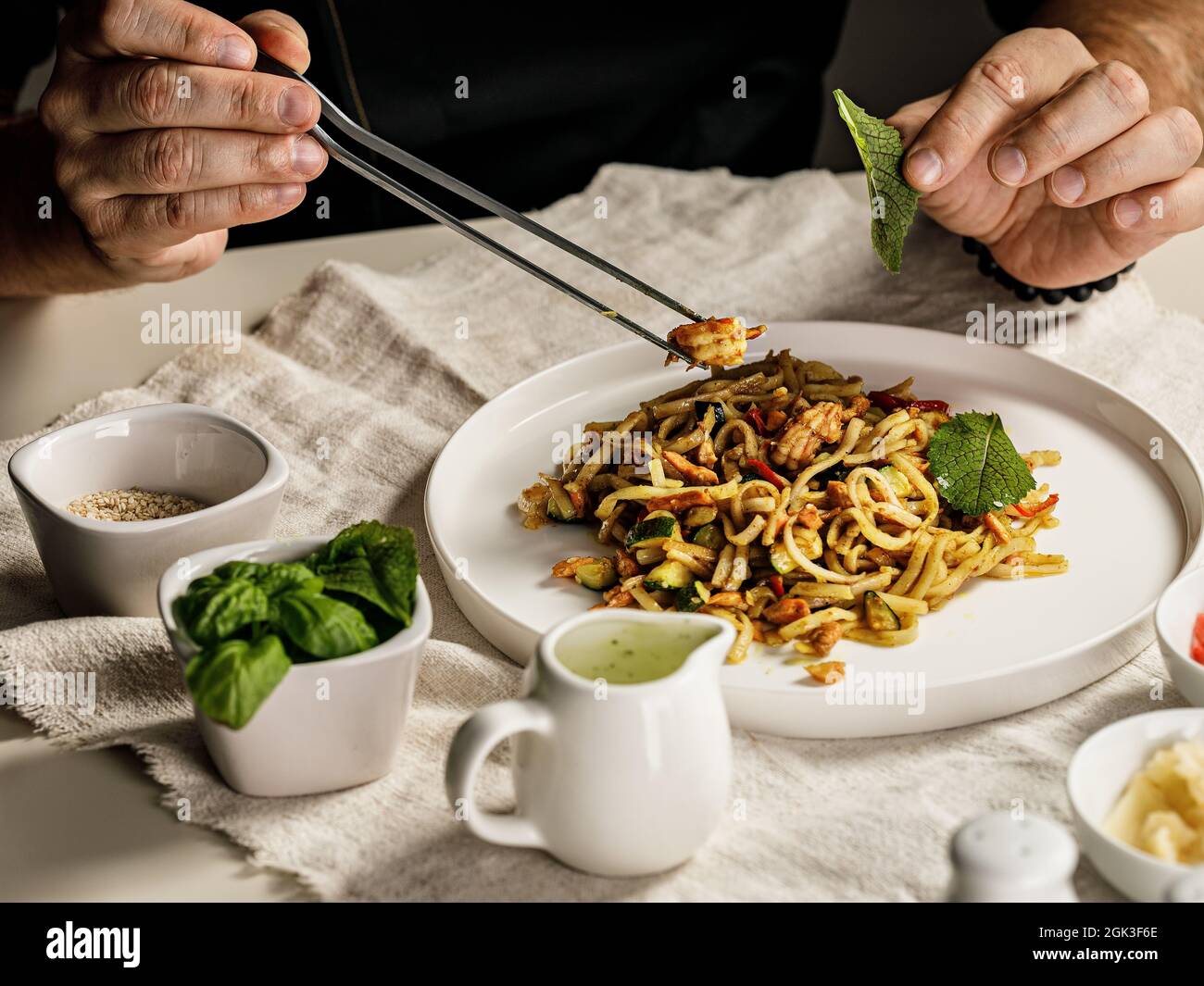 Traditional pasta with seafood. The chef prepares a pasta marinara. The