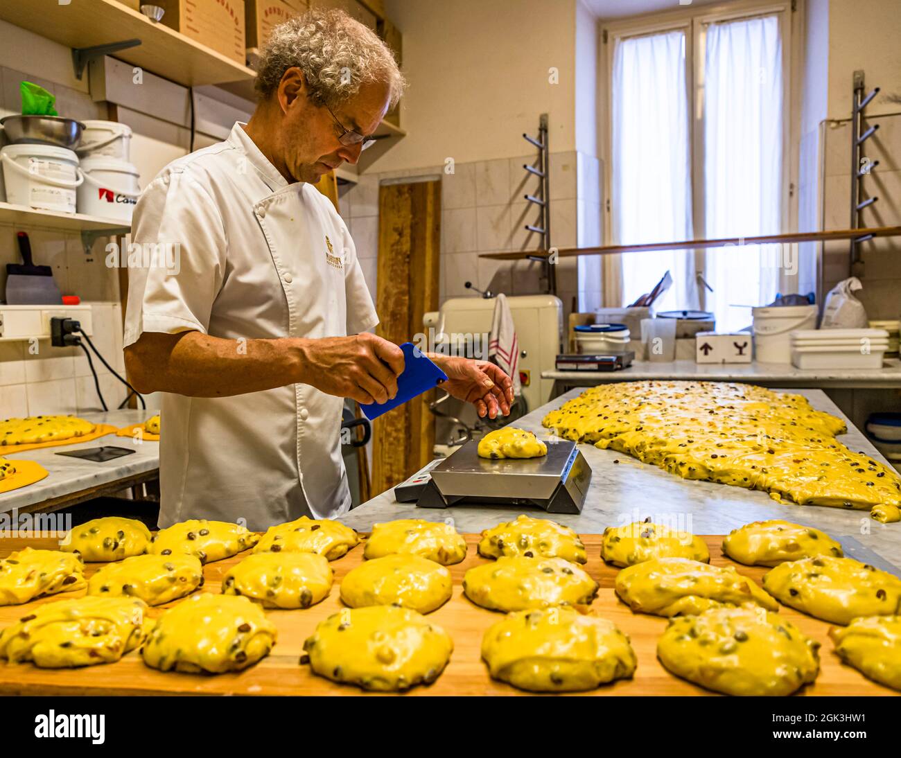 Portioning, weighing and shaping of panettone in the Pasticceria Marnin in Locarno, Switzerland Stock Photo
