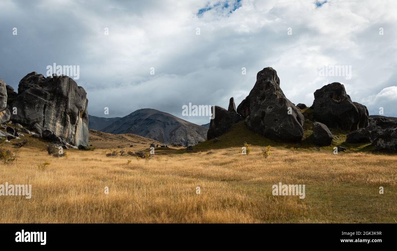 Panorama view of giant boulders of the Castle Hill against a stormy sky, Canterbury, New Zealand. Stock Photo