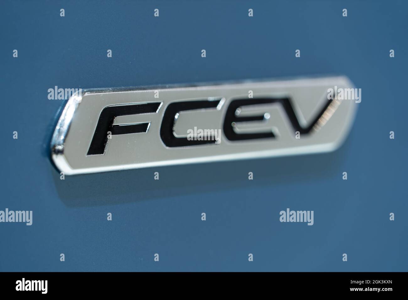 Close up of nameplate Fuel cell electric vehicle on board of hydrogen powered car. Stock Photo