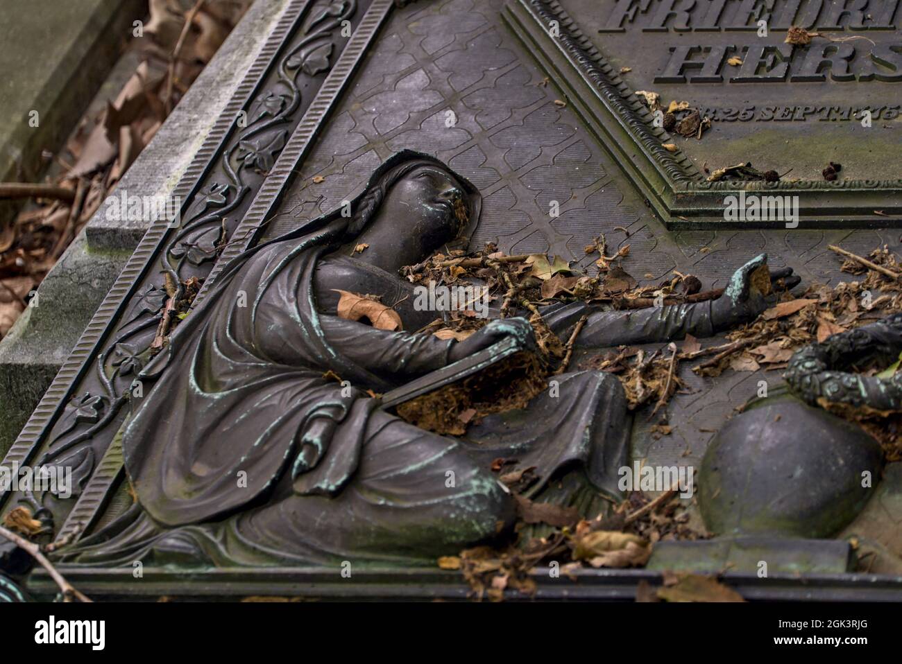 Part of a weathered ornamental stone sculpture in a cemetery Stock Photo